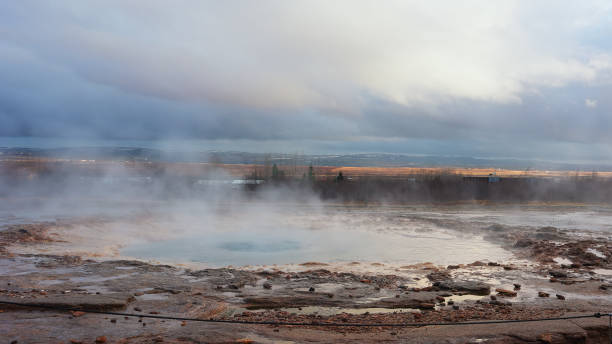 istock Icelandic geyser in panoramic scenery 1490564900