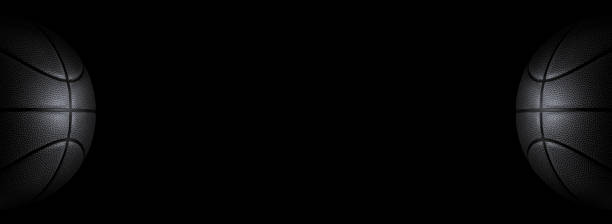 istock black basketball on a black background Panorama or free space 1490567272