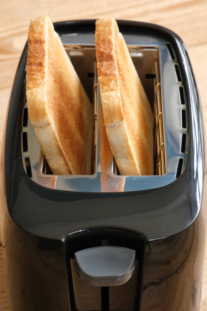 istock Closeup of a black toaster with toasted bread 1490568173