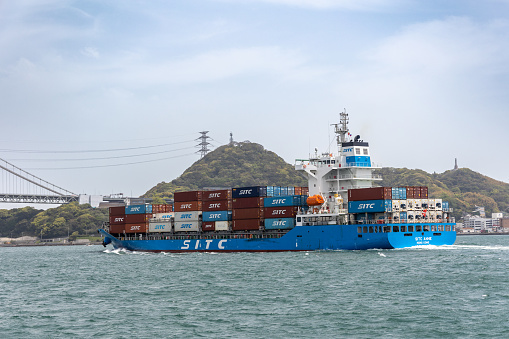 Kanmon Straits, Japan - April 18, 2023 : SITC ANHE Container Ship sailing at Kanmon Straits, Japan. It built in 2023 and currently sailing under the flag of Hong Kong.