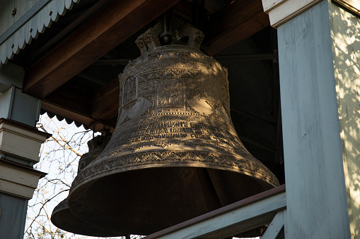 Ancient church tower big bell close up