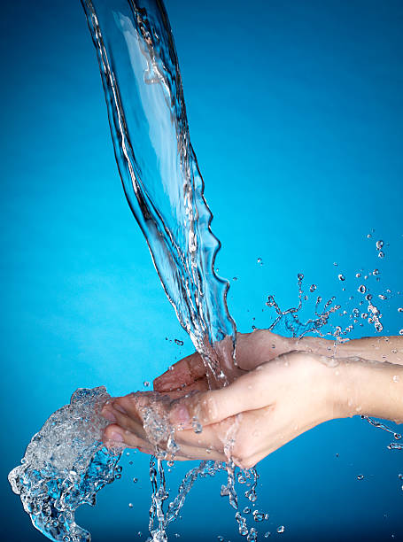 istock Hands and stream of water. 149057060