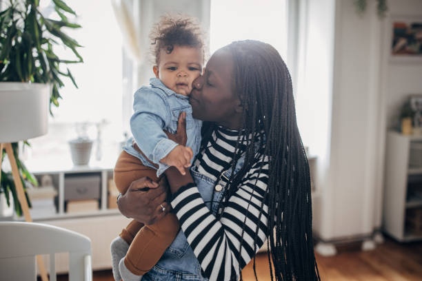 istock Mom holding her baby boy 1490572515