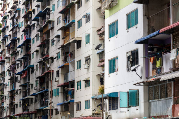 Exterior of compact residential building. Exterior architecture. Low cost residential building outlook. Low cost living condition. Urban poverty.