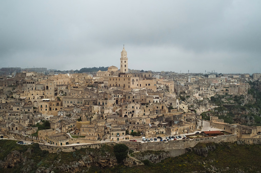 Matera (Basilicata, Italy) is located on a canyon, which defines Matera’s landscape and architecture. Inhabited since the Paleolithic era, established by the Romans in the 3rd century BC, the town is famous for its cave dwellings. The Sassi di Matera is the ancient town of houses carved into the rock. People lived here until the 1950s, but then they were moved because the place needed restoration. Today pubs, restaurants and hotels are found in this location.