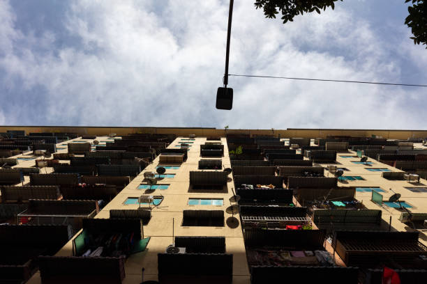 Exterior of compact residential building. Exterior architecture. Low cost residential building outlook. Low cost living condition. Urban poverty.