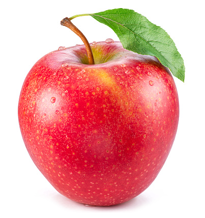 Ripe perfect red apple covered with small water drops on white background.