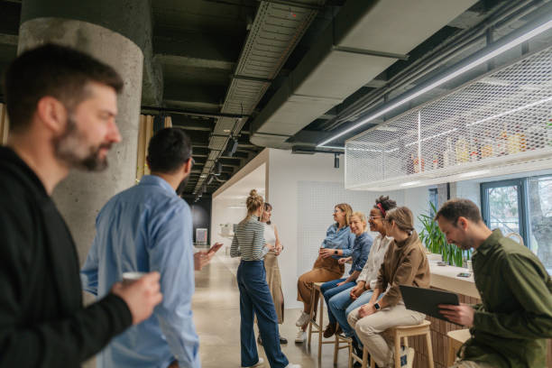 istock Colleagues taking a coffee break in the office cafeteria 1490577000