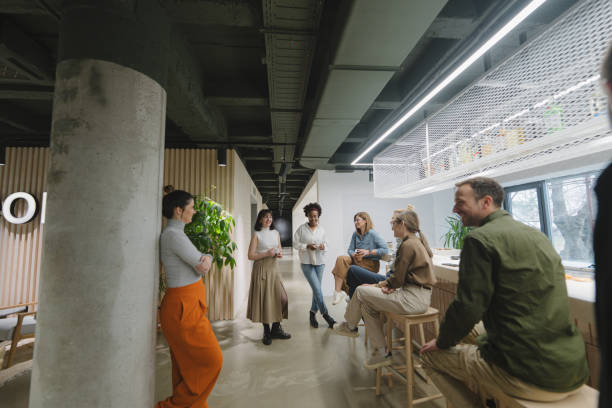 istock Colleagues taking a coffee break in the office cafeteria 1490577018