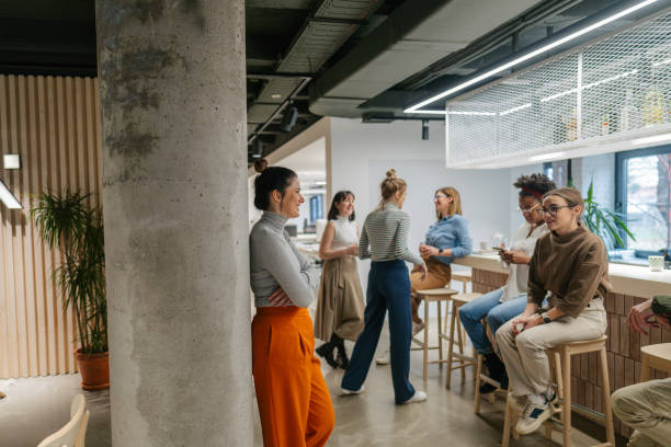 istock Colleagues taking a coffee break in the office cafeteria 1490577032