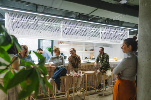 istock Colleagues taking a coffee break in the office cafeteria 1490577047