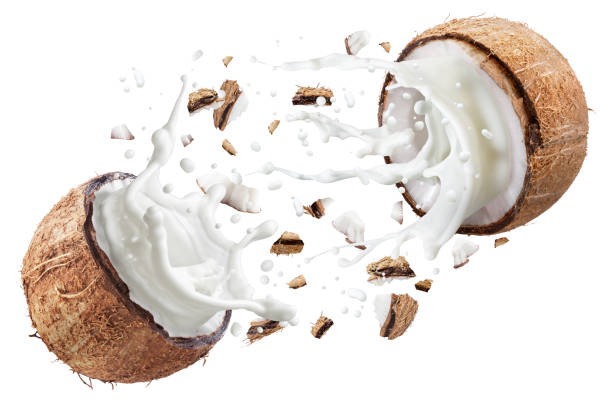 istock Coconut milk flying out from split coconut fruit. File contains clipping paths. 1490578379