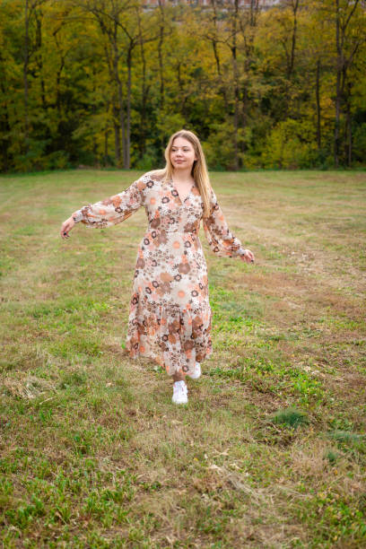 istock Woman spinning in autumn meadow 1490578418