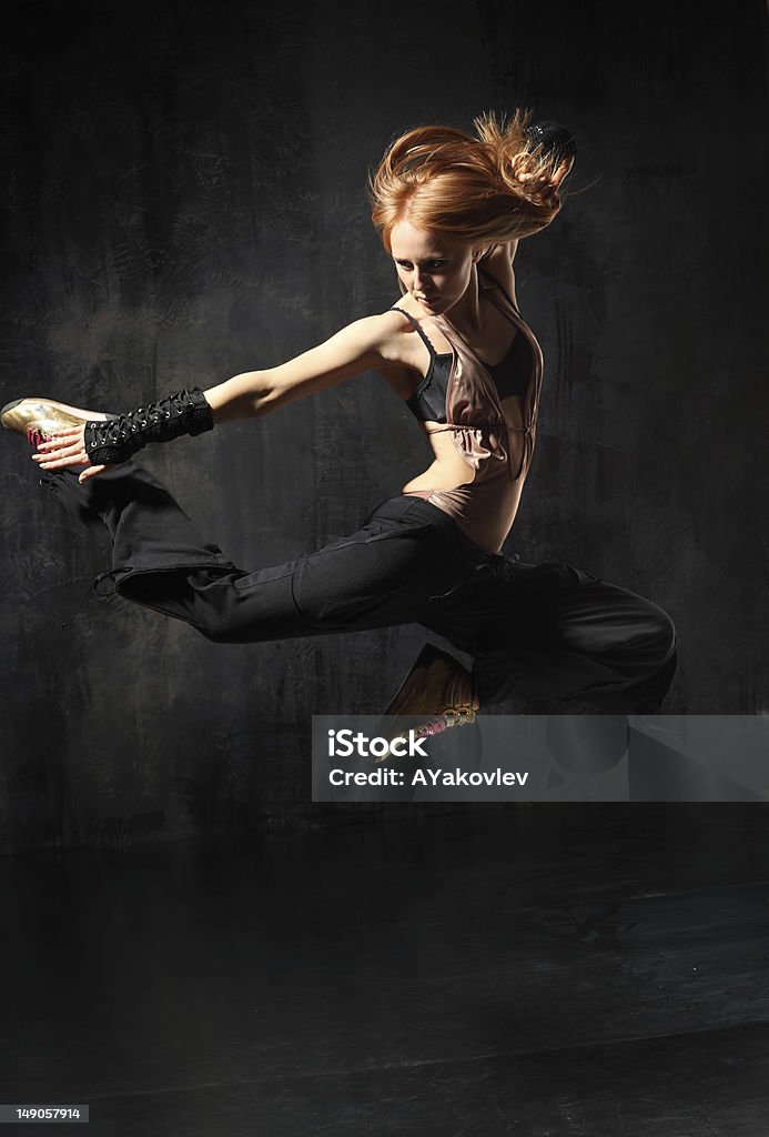 the dancer modern style dancer posing on studio background http://www.ayakovlev.com/lb/jump.jpg Acrobat Stock Photo