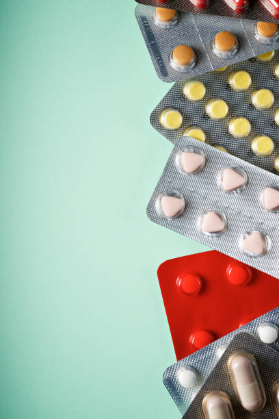 istock Medication tablets packed in blister packs on a table 1490579623