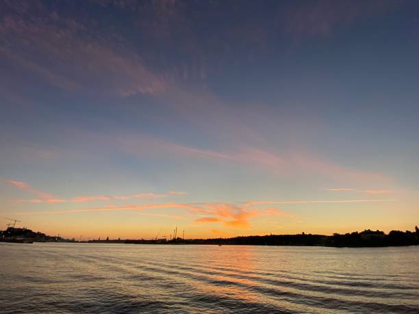 istock Waves Water Pink Neon Sunset Pink Clouds Skyline Stockholm 1490580674