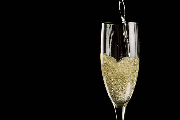 istock Single champagne flute filled with sparkling wine 149058512
