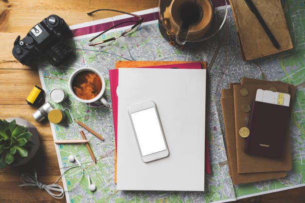 istock Travel concept flat lay, blank screen phone and white magazine mockup 1490586998