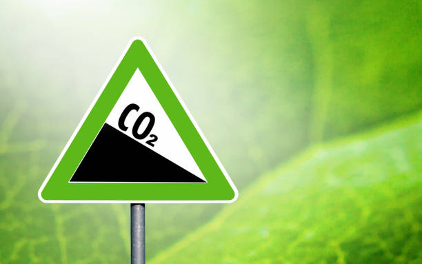 istock CO2 emission reduction sign green triangular shape against a clear blue sky 1490587125