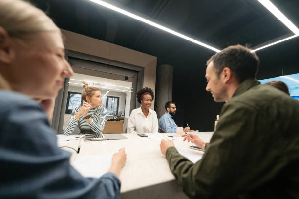 istock Coworkers brainstorming in a meeting 1490587801