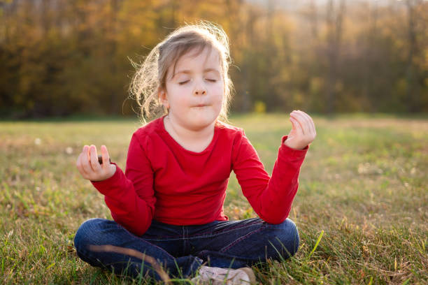 istock Girl meditating in nature 1490587880