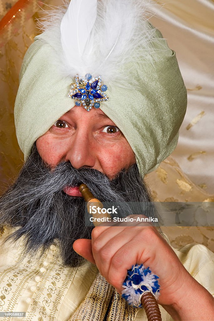 Turban and water pipe Arabian turban sultan with a water pipe Adult Stock Photo