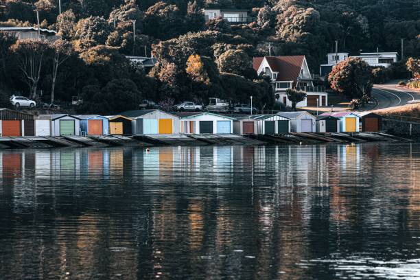 istock Cluster of brightly-colored homes reflected in the lake 1490590653