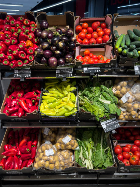 istock Fresh vegetables lie in boxes on the shelves in the store 1490591604