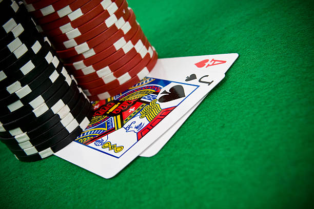 istock Ace of hearts and black jack with poker chips 149059188