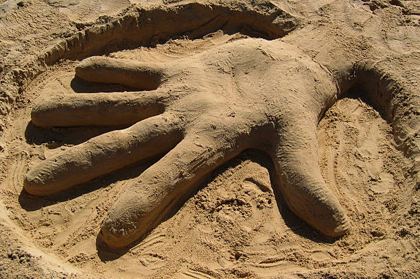 istock Sand Sculpture of a Hand 149059604