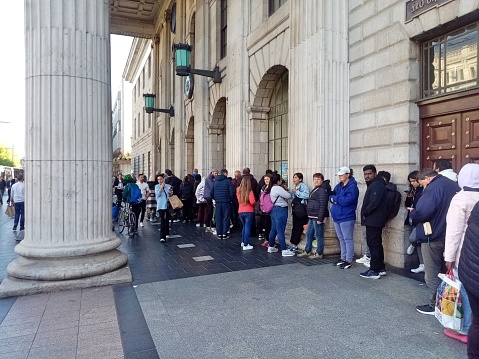 16th May 2023, Dublin, Ireland. A queue of people waiting for the free food service soup kitchen, run by Muslim Sisters of Eire, to open outside the GPO building on O'Connell Street.