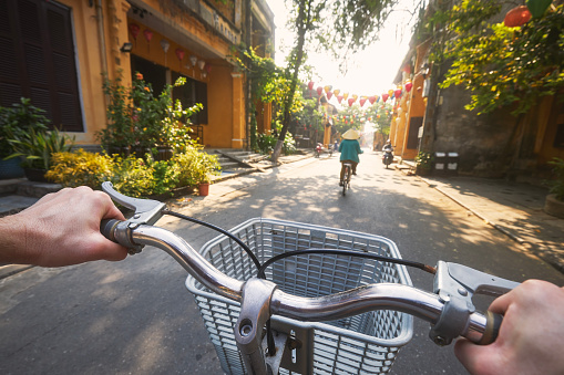 POV bicycle riding of tourist in ancient city Hoi An