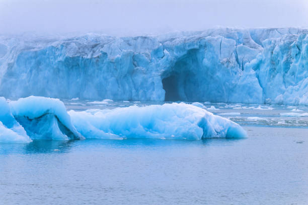 istock Glacier shelf with a cave by the sea 1490597903