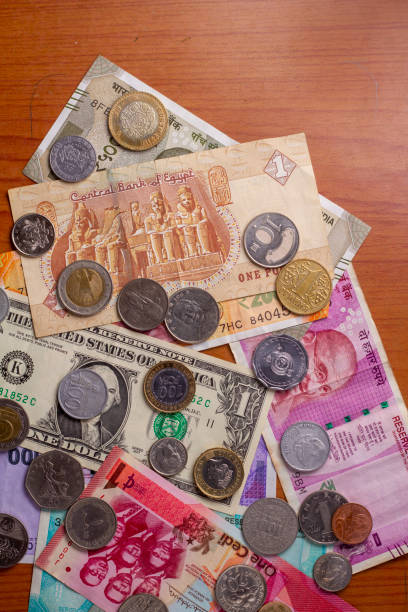 istock Major currencies in the world. notes and coins background. 1490598510