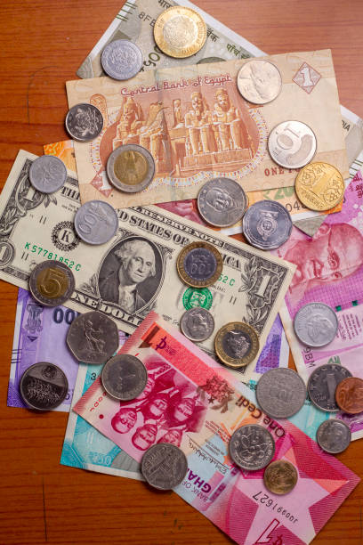 istock Major currencies in the world. notes and coins background. 1490598535