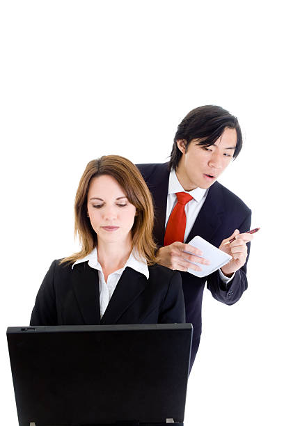 Asian Business Man Cheating Stealing Shoulder Surfing Caucasian Woman Isolated Asian man looking over the shoulder of a Caucasian woman working on a computer.  Cheating/industrial espionage concept.  Isolated on white background.  -See lightbox for more. men close up 20s asian ethnicity stock pictures, royalty-free photos & images