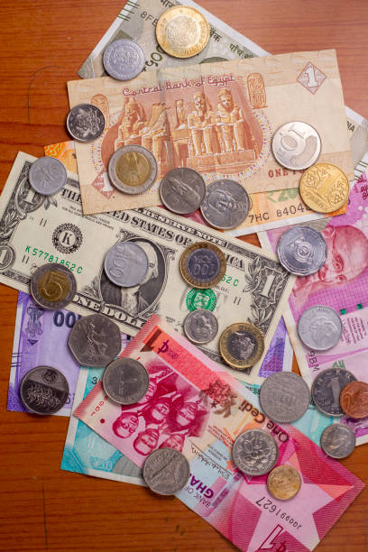 istock Major currencies in the world. notes and coins background. 1490598728