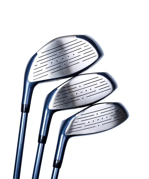 Photo of Close-up of three sizes of silver golf club heads