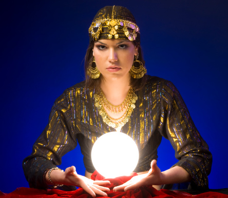 Fortune-teller with lit up crystal ball