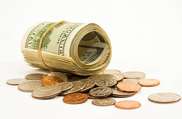 istock roll of money and coins 149060636