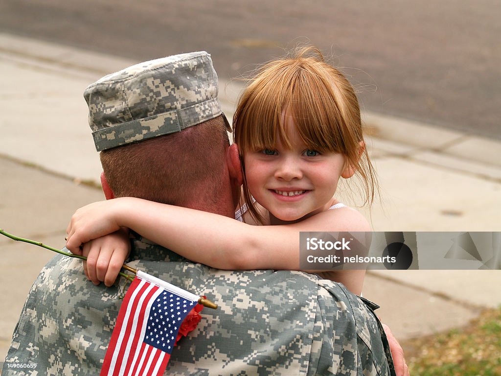 Home at Last A soldier hugging a loved one after returning from Iraq. Armed Forces Stock Photo