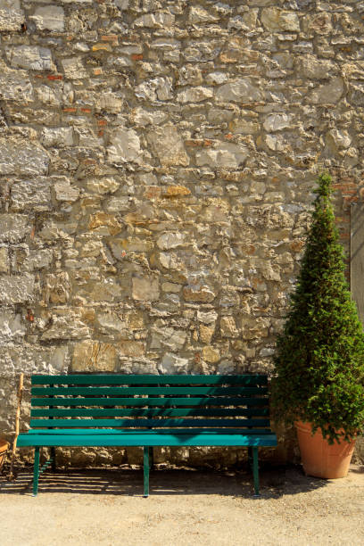 Rustic stone wall and Bench in Fonterutoli Tuscan village
