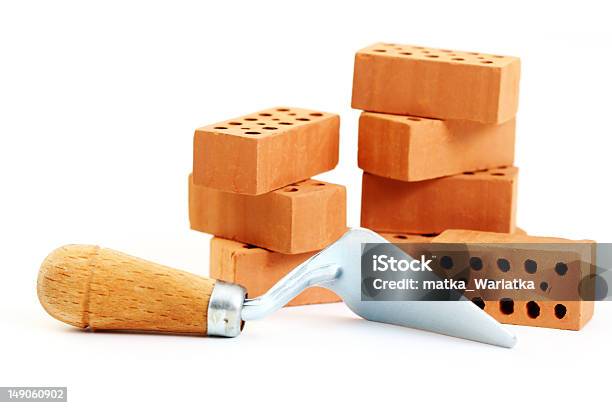 A Shovel Tool And Several Stacked Bricks Stock Photo - Download Image Now - Construction Material, Brick, Building - Activity