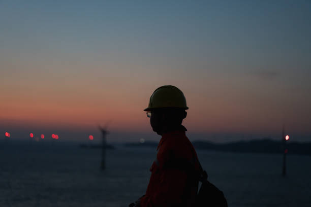 istock Romantic sky at an offshore wind farm at dawn 1490610267