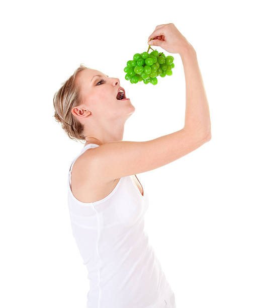 Young woman and grape stock photo