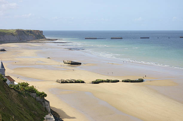 The port of Arromanche WWII The floating port of Arromanche used during Worl War II, also known as Mulberry port, was built for serving the troops on the beach of Arromanche, Normandy, France normandy photos stock pictures, royalty-free photos & images