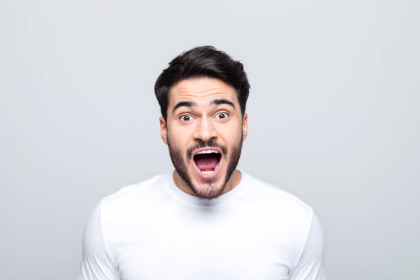 istock Headshot of excited young man 1490615156