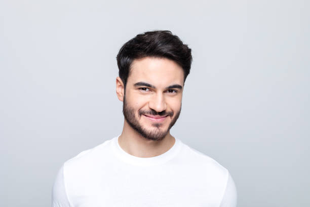 istock Headshot of pleased young man 1490615284