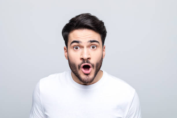 istock Headshot of shocked young man 1490615342