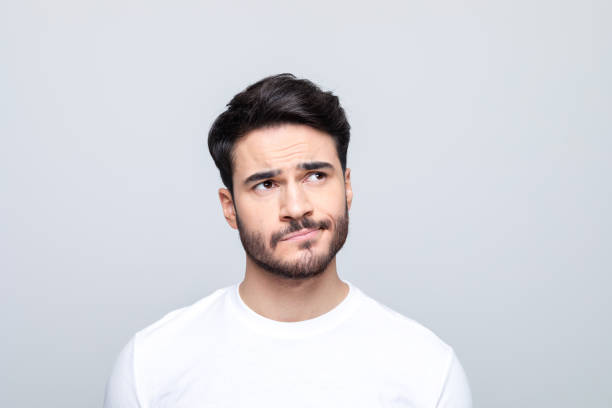 istock Headshot of worried young man 1490615456